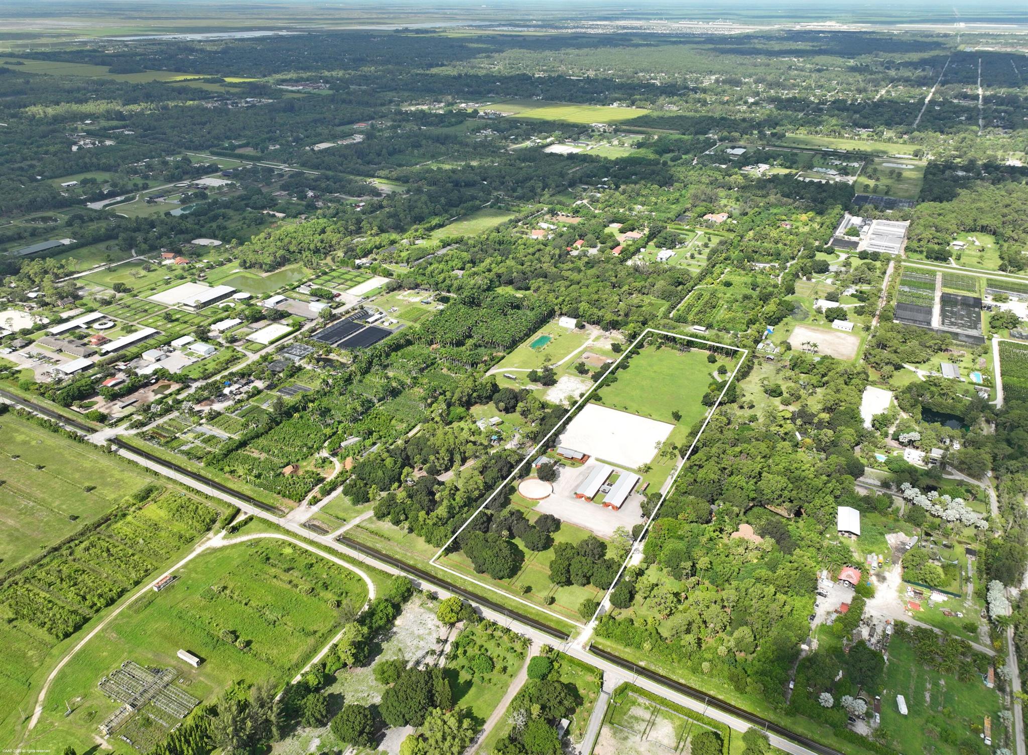A private training oasis with 2 barns totaling 26 stalls, oversized arena measuring 250 x 250, 4.5-acre grass riding field, round pen and 12 large paddocks with mature shade trees. There are two center-aisle barns, with 14-stalls and 12-stalls, and one with a studio apartment. Each barn has 2-tack rooms, feed & storage rooms, half-bath, and 3-grooming stalls. There are 4 wash racks in the courtyard, 2 of which are covered. There is a clubhouse with a kitchenette, 2 private staff rooms, 2 full bathrooms and beautiful observation deck overlooking the riding arena. The equipment shed also includes an office/studio with full bath. The entire property is completely fenced with an electric gate. This property is perfect for all disciplines of riding and a great income producing opportunity.