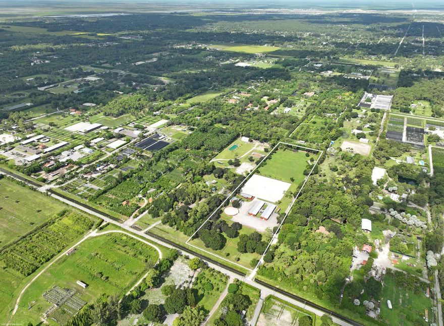A private training oasis with 2 barns totaling 26 stalls, oversized arena measuring 250 x 250, 4.5-acre grass riding field, round pen and 12 large paddocks with mature shade trees. There are two center-aisle barns, with 14-stalls and 12-stalls, and one with a studio apartment. Each barn has 2-tack rooms, feed & storage rooms, half-bath, and 3-grooming stalls. There are 4 wash racks in the courtyard, 2 of which are covered. There is a clubhouse with a kitchenette, 2 private staff rooms, 2 full bathrooms and beautiful observation deck overlooking the riding arena. The equipment shed also includes an office/studio with full bath. The entire property is completely fenced with an electric gate. This property is perfect for all disciplines of riding and a great income producing opportunity.