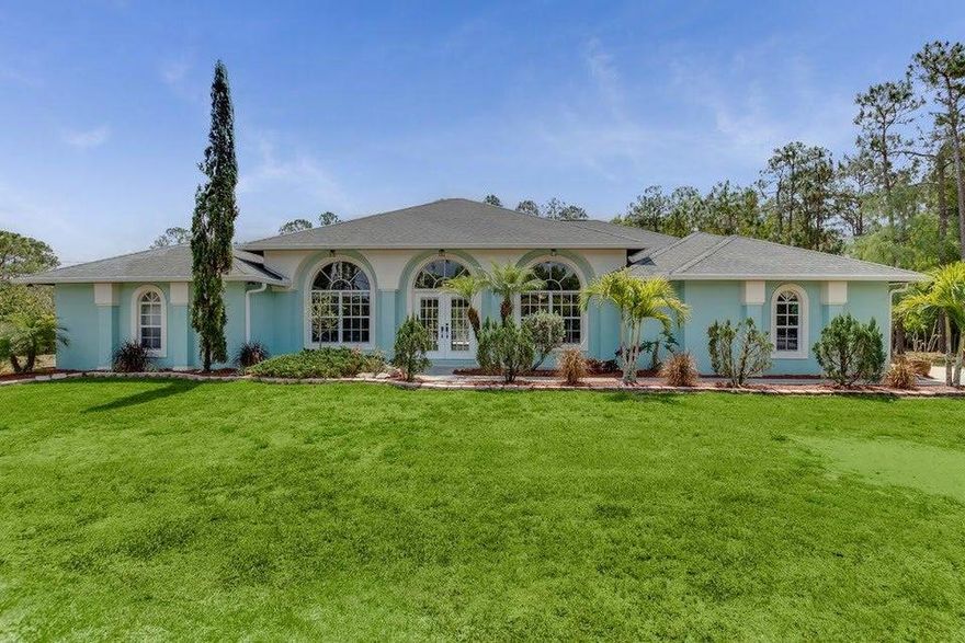 Come see this great home in Loxahatchee, over-sized corner lot and paved road.  Three huge bedrooms (could be made 4) with 2 bathrooms. Fully fenced property with double entry access.  One large bedroom has exterior door so could be used as home office. Large Master bedroom has enormous closet with closet organization system  and large bathroom with double sink, soaking tub, and step in shower.  Updated kitchen, double pantry, tile, laminated and carpeted floors, vaulted ceilings, decorative moldings, screen porch, wood deck and fire pit, security cameras throughout and alarm system. Lots of natural light in this home through all the windows.  Interior laundry. Additional detached storage shed and gun safe included.  Exterior electric for RV power.