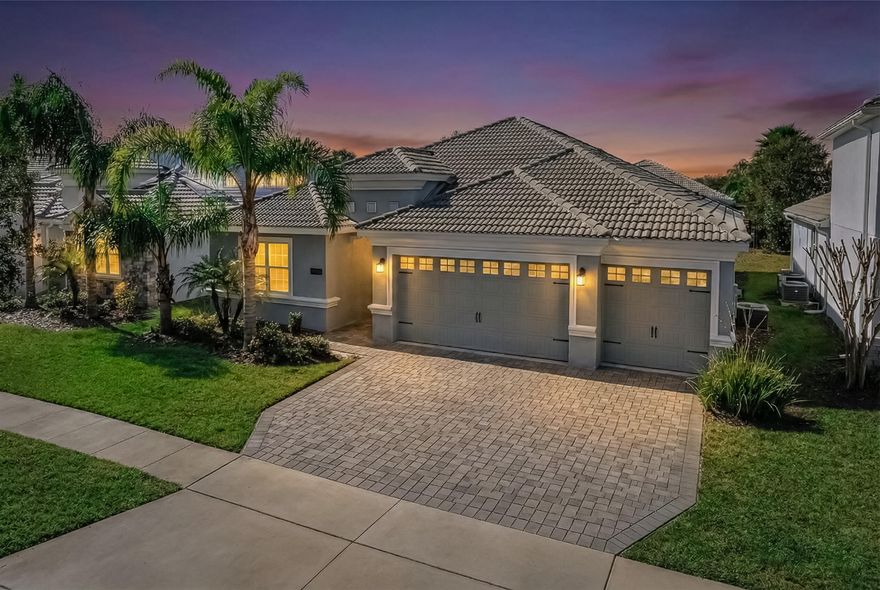 Welcome to 1488 Olympic Club Boulevard, a beautifully cared-for 4-bedroom, 3-bath residence with a 3-car garage, built in 2019 and located inside the gated ChampionsGate Country Club community. This home offers a modern layout, quality finishes, and a comfortable flow that makes it ideal for both everyday living and hosting guests.

Inside, the open floor plan connects the main living areas seamlessly, creating a bright and inviting space. The kitchen is centrally positioned and features stainless steel appliances, quartz countertops, generous cabinet storage, and a large island that works perfectly for meal prep, casual dining, or entertaining. Neutral finishes and thoughtful details throughout the home create a clean, move-in-ready feel. The primary bedroom is set privately at the rear of the home and includes a spacious walk-in closet, dual sinks, and a large walk-in shower. Additional bedrooms offer flexibility for guests, family members, or a home office.

Recent features and upgrades include interior and exterior paint, updated lighting, ceiling fans, a whole-home water filtration system, reverse-osmosis drinking water system in the kitchen, impact windows, window treatments with blackout options in select rooms, and energy-efficient systems throughout.

Step outside to a covered patio and backyard space with peaceful garden viewsperfect for relaxing, outdoor dining, or enjoying the Florida weather year-round.

Located in ChampionsGate Country Club, residents have access to resort-style amenities including golf, tennis, pools, fitness centers, dining options, and multiple clubhouse facilities. The HOA covers lawn care, security, cable, internet, and additional community services, creating a convenient, low-maintenance lifestyle. A well-maintained, newer construction home in a sought-after gated golf communityready for its next owner to enjoy.