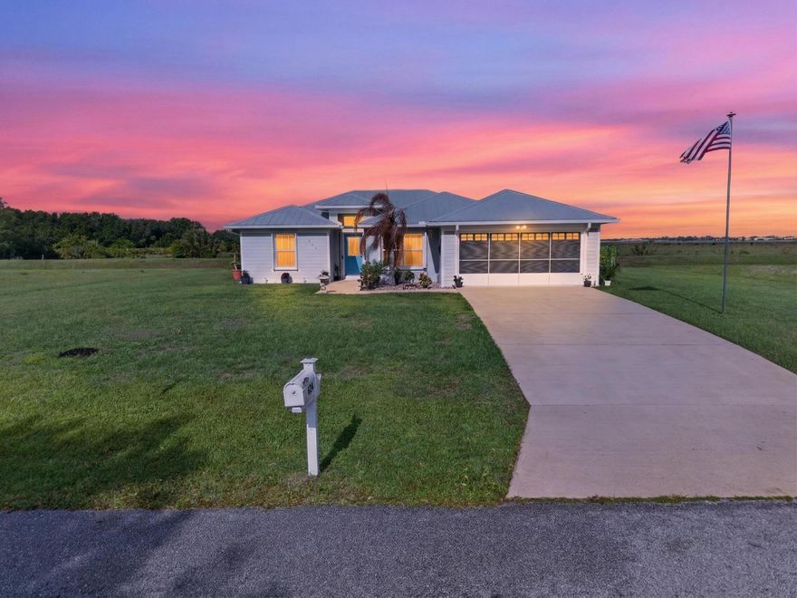 Charming 3/2/2 home w/modern updates. Beautifully maintained home offers comfort and style, on a large open lot. Featuring 9' ceilings with plank flooring in the main living areas, this home provides a spacious layout perfect for family living. Newer matching Stainless appliances. Ceiling fans in each room & pendant style light fixtures in dining area & breakfast bar. Double-paned windows and hurricane shutters. Additional upgrades include rain gutters and garage screen door. Well-maintained A/C system.  Short walk to the Eco Park and Dog Park. Spring Lake offers tennis/pickleball courts, playground, clubhouse with restaurant. Conveniently located to shops, medical facilities, HGTV remodeled downtown, restaurants, Sebring Int'l Speedway & more. Don't miss out on this move-in ready gem.