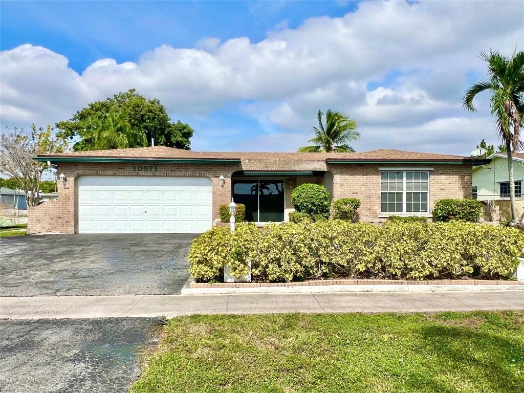 Photo of 10571 Sunset Strip, Sunrise, FL 33322 (MLS # F10536395)
