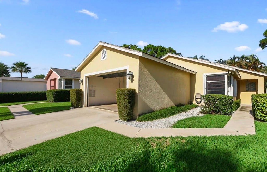 Photo of 172 HARBOR LAKE Circle, Greenacres, FL 33413 (MLS # B26073026)