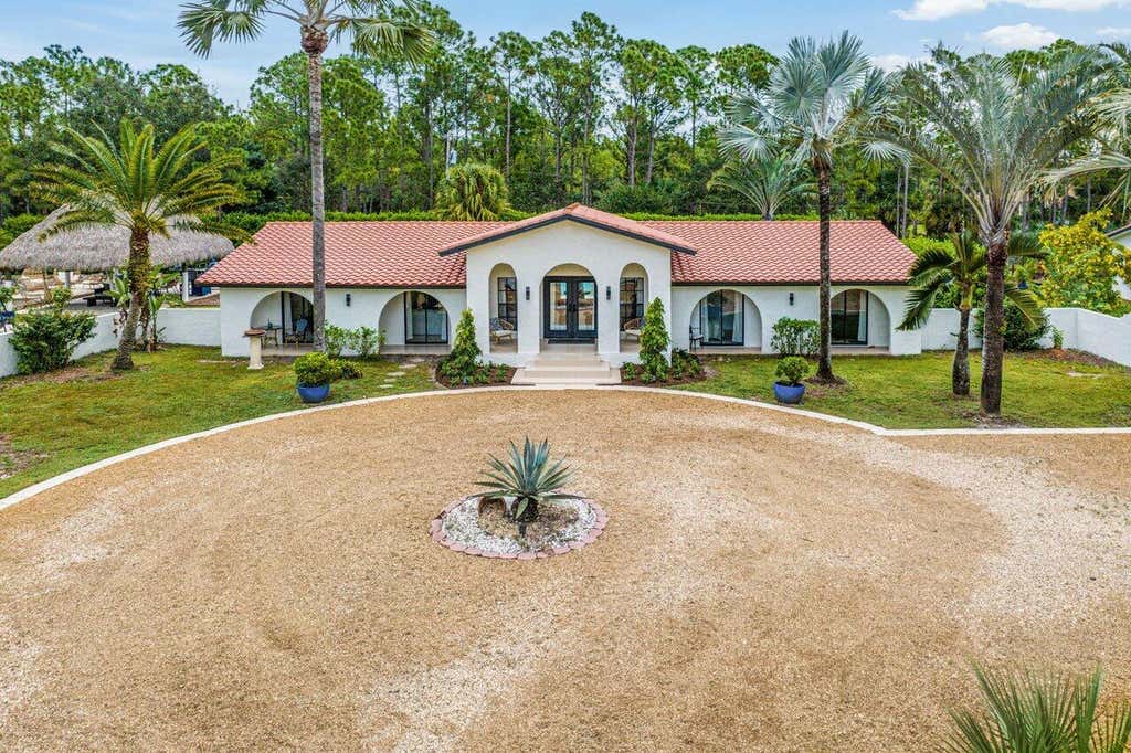Photo of 13619 Deer Creek Drive, Palm Beach Gardens, FL 33418 (MLS # R11033985)
