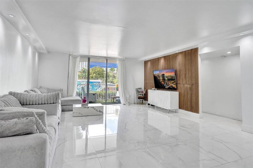 GORGEOUS BRIGHT 2 BEDROOM 2 FULL BATHS IN ADMIRALS PORT LOCATED IN AVENTURA! LARGE UNIT 1664 SF! CONVENIENTLY LOCATED FIRST FLOOR UNIT! KITCHEN IS BRIGHT AND AIRY FEATURING BEAUTIFUL WHITE FAUX CABINETRY AND MATTE BLACK HARDWARE, GRANITE COUNTERTOPS, AND STAINLESS STEEL APPLIANCES! BEAUTIFUL PORCELAIN TILE FLOORS THROUGHOUT COMMON AREAS AND WOOD FLOORS IN BEDROOMS. LIVING ROOM FEATURES MODERN WOOD TV PANELS AND LEADS OUT TO A LARGE OPEN BALCONY. MASTER BEDROOM FEATURES BUILT-INS & MASTER BATH HAS DUAL SINKS, LED MIRRORS, AND GORGEOUS GLASS SHOWER! GUEST BATHROOM ALSO FEATURES LED MIRRORS, BEAUTIFUL VANITY AND GLASS SHOWER! THIS UNIT IS A MUST SEE! BUILDING IS LOCATED RIGHT ON THE WATER! CLOSE TO SHOPPING, AVENTURA MALL, TOWN CENTER, PLACES OF WORSHIP AND BEACHES! HOA DUES REUCED !