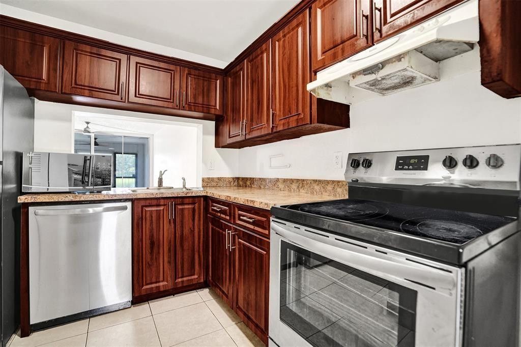 Photo of 9440 Poinciana Place #101, Davie, FL 33324 (MLS # B26015527)