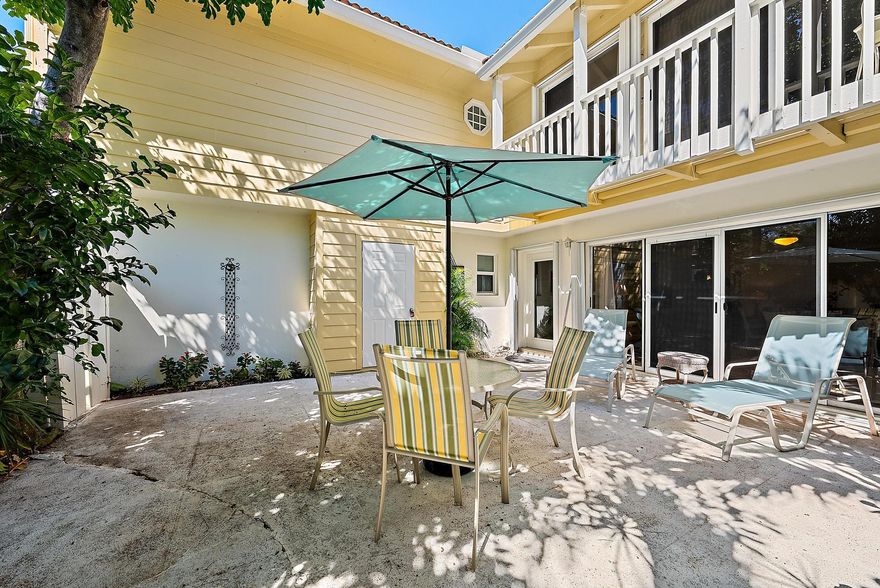 This timeless Key West styled and furnished Townhouse is a spacious unit with 3 bedrooms, 2.5 baths and private outdoor patio area. The first level provides an open concept design with tile flooring throughout. The south facing interior sliding glass doors open directly to the private courtyard, offering extended living space. The kitchen has wood cabinetry, granite countertops, stainless appliances and a breakfast bar. The open floor plan is perfect for casual dining and entertaining. Upstairs are 2 guest bedrooms that share a full bath. The large master suite has a walk-in closet and a lovely master bath with a step-in shower and dual sinks. The community has a direct and private pathway to the beach. No pets. 2 assigned parking spaces.
