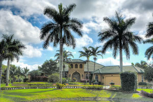 10 acres in the desirable equestrian Homeland community! This 4-bedroom + office, 3-1/2 bath pool home is absolutely stunning. Crown molding and beautiful solid wood doors & columns throughout. Split bedroom plan with extremely spacious bedrooms. Pool/patio area is perfect for entertaining with a summer kitchen. Property has a 4-stall CBS barn with storage, tack & feed rooms, bath room, three paddocks with room for more!