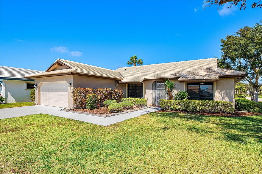 3 bed 2 bath corner lot in Camino Woods II- great location in Boca- close to Town Center, 95 & Turnpike. As soon as you walk into this well-maintained home, you are welcomed with warm colors & tons of natural light. Beautiful open great room w/ high ceiling height flows out to a covered patio. Additional open-air patio space is accessible from the eat-in kitchen, which overlooks the back gardens and canal view. All hard surface flooring throughout NO CARPET! NEW ROOF IN 2018. Beautiful Porecelain tile in the main areas and luxury vinyl floors in bedrooms. Beautiful and bright kitchen with upgraded stainless steel appliances, under- and over-cabinet lighting, and plenty of storage space. Refrigerator and generator in garage to convey with the home. Don't let this one go- it will not last! Updated highlights in this Boca beauty: Interior painting has just been refreshed, and all landscaping has been updated. Your HOA maintains your lawn care and trimming and access to Pool, clubhouse and hot tub. Blinds added, New roof 2018, Updated electrical panel and HVAC system in 2023, Recessed LED lights and speakers in the ceiling of the Great room, removal and addition of all new insulation in the attic space, American Home Shield Warranty for systems and appliances (both refrigerators), which will transfer with the property. Termite bond in place and will transfer- ends in May 2026.