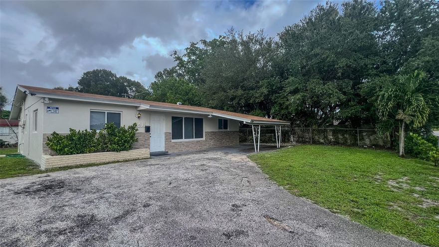 Recently renovated home with open layout, tile floors, updated kitchen and baths, and fresh paint. Large backyard  carport and driveway parking, no parking restrictions. Close to SR441, Sunrise Blvd and I95, shopping, dining and parks in The Greater Fort Lauderdale Area.