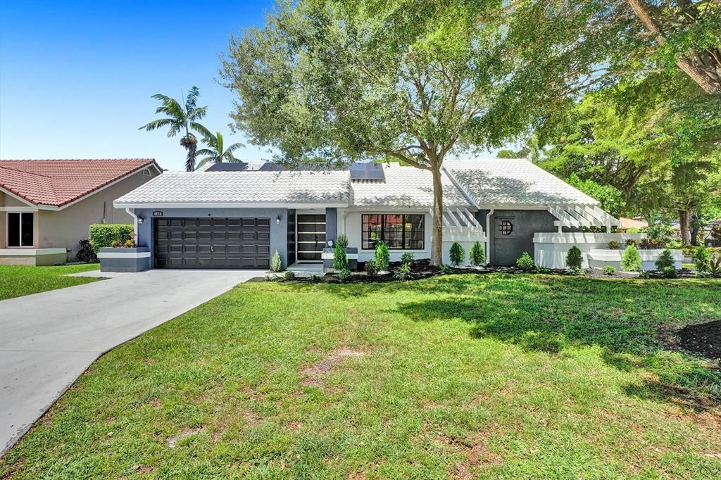 Photo of 4772 NW 60th Lane, Coral Springs, FL 33067 (MLS # R10825574)