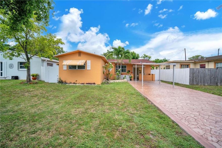 Perfect for investors or a family with in-laws! Walk into this 3 bed, 2 bath single family home with a separate entrance efficiency with 1 bath and a full small kitchen that can be used as an in-law suite or income producing unit. Enjoy the privacy of your large fenced backyard and Relax under your covered patio while enjoying your mango margarita from your own mango trees. Plenty of room for pets to run around & a pool. 1 car carport with 4 additional parking spots. *Impact Windows redone in 2019*Located just off of 441, North of Miramar Parkway with easy access to I-95 & Turnpike. Close to lots of shopping, dining, & entertainment found at the Hard Rock Guitar Hotel & Casino, Downtown Hollywood, Hollywood Beach, & so much more. Do not miss out on this great opportunity to own this home!