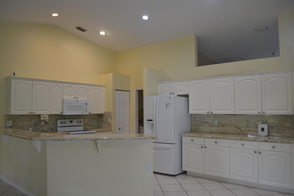 Photo of 1104 Raintree Lane, Wellington, FL 33414 (MLS # B26033231)