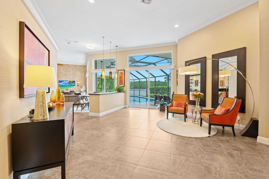 Beautifully updated lakefront pool home ideally situated on a quiet cul-de-sac street within the sought-after golf course community of Weston Hills. This exceptional residence features a desirable triple split floor plan offering privacy & flexibility for family and guests. Enjoy seamless indoor-outdoor living with new impact sliders that open to a stunning pool & lake view. Full accordion shutters, roof replaced in 2011, A/C (2012), and a resurfaced pool & deck (2021). All new SS appliances, New Washer 2023 & reinforced garage door. The outdoor space is perfect for entertaining with a built-in grill, spacious deck & serene waterfront setting. Wide open living areas, high volume ceilings,  A rare opportunity to own a move-in ready home combining comfort, style, and an unbeatable location.