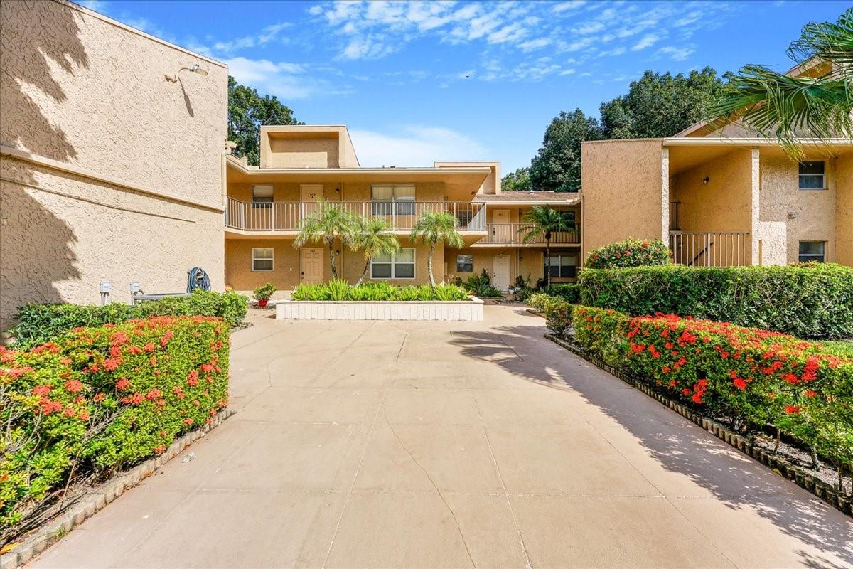Stunning view of the Woodmont Golf and Country Club from wrap around balcony. Features include new appliances, modern kitchen with quarts countertop, bathrooms with exquisite finishes and fixtures, wood and tile floors throughout. 2 master bedrooms with ensuite, both with spacious walk-in closets, large exterior storage room and protected storm shutters. The open-concept layout includes vaulted ceiling, plus an in-unit full size washer/dryer. Enjoy the community pool and walking/jogging paths. This is an all-age community. Conveniently located near fire station, hospital, shopping, dining, library, community center, schools, and highways. Consider making this your home today.