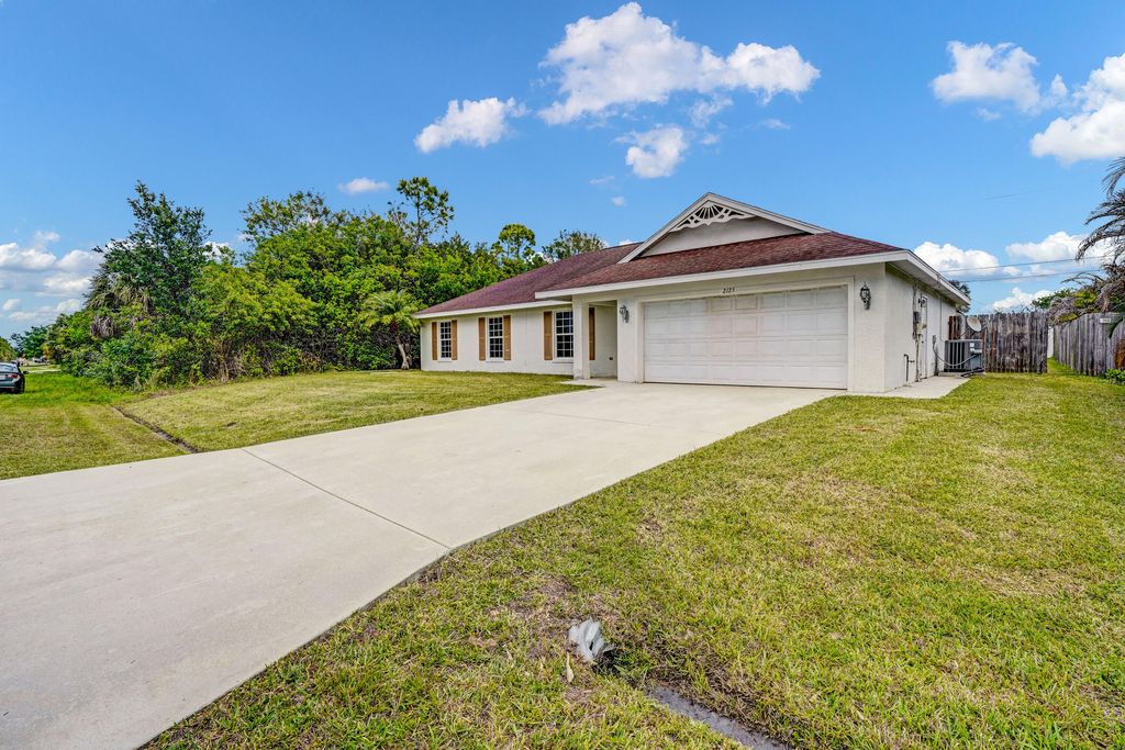 Photo of 2125 SW Salvatierra Boulevard, Port Saint Lucie, FL 34987 (MLS # B26015761)