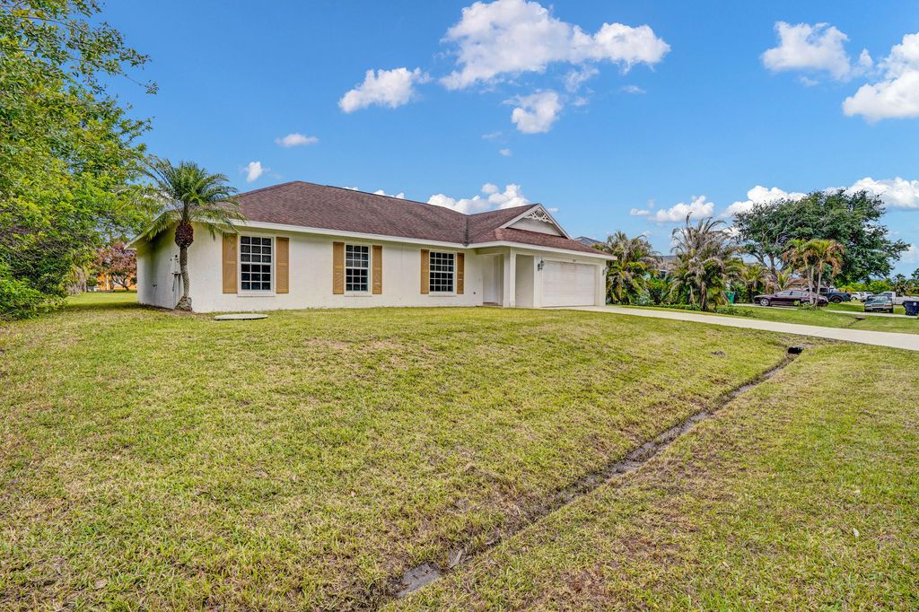 Photo of 2125 SW Salvatierra Boulevard, Port Saint Lucie, FL 34987 (MLS # B26015761)
