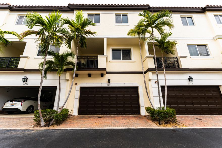 Welcome to Coastal Bay, a charming gated community just minutes from the beaches and downtown Delray. This 3-story, 3-bedroom, 3.5-bath townhome with a 2-car garage features a versatile entry-level bedroom with a full bath - perfect for guests, a home office, gym, or media lounge. The second floor has an open-concept kitchen with generous counter space, a dining area, a large living room, and a convenient half bath. Upstairs the primary suite offers a walk-in closet and an updated master bath, while the secondary bedroom includes its own private full bath. Enjoy a vibrant, family-friendly community with a pool, jacuzzi, fitness center, internet, and cable all included in the affordable HOA. There is an amazing park across the street perfect for children and dogs