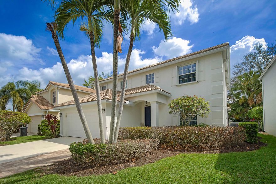 This beautiful 5 bedroom home with 3 full baths is a must see.  Located in the desirable gated community of Bent Tree in the heart of Palm Beach Gardens, this home has one of the largest floor plans in the development.  It features a new roof (2024), with partial impact windows, accordion shutters, and wood plantation shutters.  The kitchen features a gas stove with modern stainless appliances with plenty of cabinetry & storage space.. Natural gas fuels the stove, tankless water heater, dryer, and pool heater. Beautifully engineered wood flooring with tile flooring in the kitchen & baths. The spacious main bedroom features two walk in closets, and a main bathroom with separate shower & tub with two vanities.  Fresh paint throughout the house. Enjoy the Florida Lifestyle!  Extended covered patio overlooking a beautiful heated pool.  Lush landscaping with fenced in patio for this pet friendly community is ideal for relaxing or hosting guests.  Bent Tree is a centrally located community.  Offering amenities such as a community pool, tennis courts, and tree-lined streets, all with relatively low HOA fees.  Enjoy the newly developed 50 acre Palm Beach Gardens Park with athletic fields and Tennis Center. The neighborhood is conveniently located near major highways & artery roads with top-rated schools, shopping & dining. Enjoy walking your kids to school.  Just a short drive to amazing beaches & golf courses.