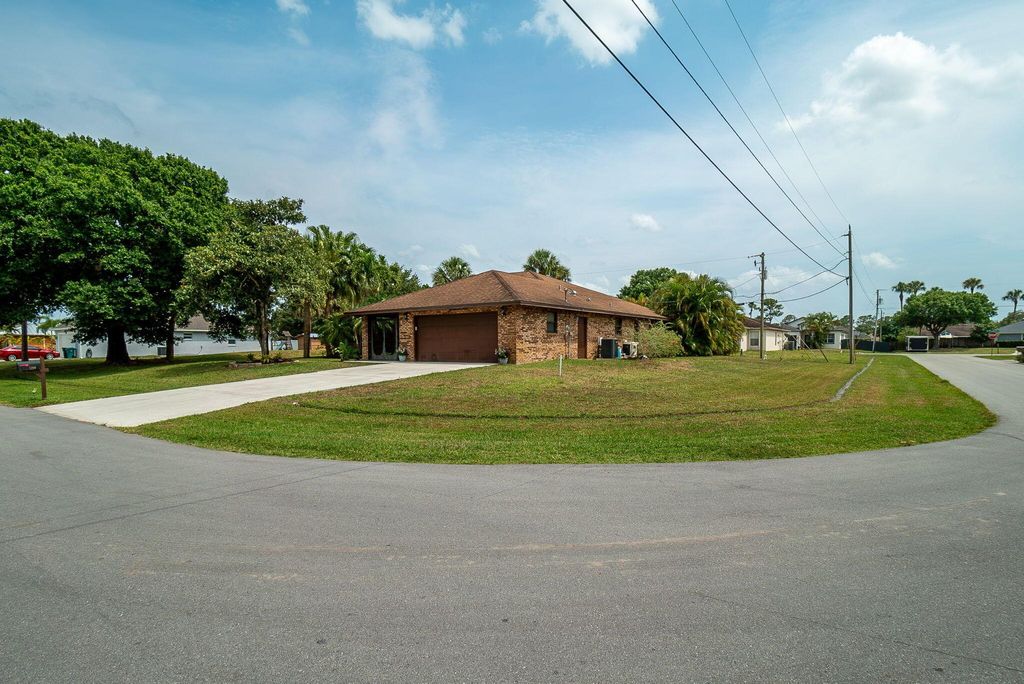 Photo of 1290 SW Thomas Court, Port Saint Lucie, FL 34953 (MLS # R10989794)