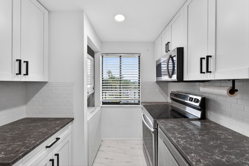 Photo of 2828 Tennis Club Drive #403, West Palm Beach, FL 33417 (MLS # R11160030)