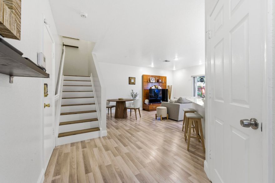 Welcome to this beautifully maintained 3-bedroom, 2.5-bath townhome in the desirable Southwind community of Greenacres! This move-in ready home features a newer roof (5 years), A/C (6 years under warranty), and water heater (1 year old), offering peace of mind for years to come. The updated kitchen is equipped with stainless steel appliances (5 years old), modern cabinetry, and an island perfect for entertaining. Enjoy new laminate flooring, fresh interior paint, and abundant natural light throughout. Step outside to your private fenced courtyard with accordion hurricane shutters for added storm protection. Conveniently located near schools, shopping, dining, and major highways. Don't miss this opportunity to own a well-maintained home in a prime location, schedule your showing today!