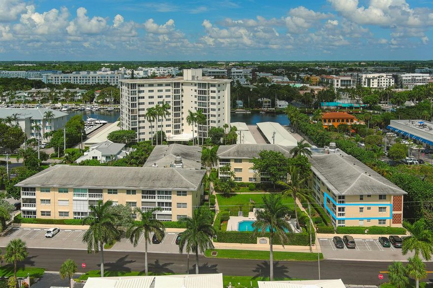 With it's Southeastern exposure, this pristine 2 bedroom, 2 bathroom corner unit offers natural light and a vibrant ambiance. Enjoy a spacious, glassed enclosed patio overlooking the heated pool and lush gardens.  Meticulously updated with a new stylish kitchen and bathrooms boasting quartz counter tops, custom cabinetry and stainless steel appliances.  The bedrooms feature wood-look floors and timeless plantation shutters.  High Impact windows and doors throughout.  Its prime location is 2 blocks to the beach, with Atlantic Ave just a 1/2 block stroll away.  Nested within a boutique style building, Delray Beach's hidden gem awaits your discovery.