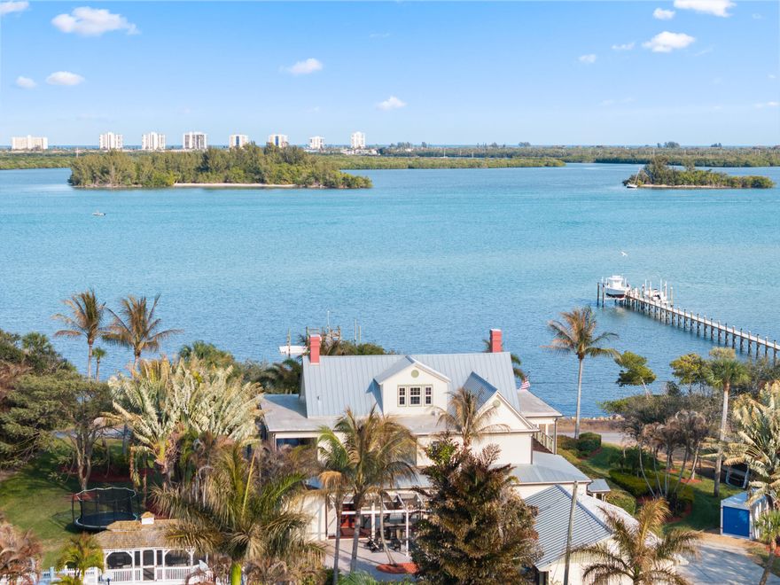 Rare opportunity to own a historic waterfront estate on nearly 1.5 acres along the Indian River in the charming community of St. Lucie Village. Featuring 235 feet of direct river frontage, a private dock, direct ocean access, and world class fishing just moments away, this remarkable property offers exceptional scale, privacy, and waterfront presence. Originally built in 1895 and thoughtfully updated for modern living, the estate offers over 5,000 sq. ft. of character-filled living space with expansive river views, generous entertaining areas, and timeless architectural charm throughout. The private, park-like grounds create an ideal setting for relaxing, hosting, and enjoying the waterfront lifestyle. this one of a kind legacy property offers a blend of history, space, and natural beauty.