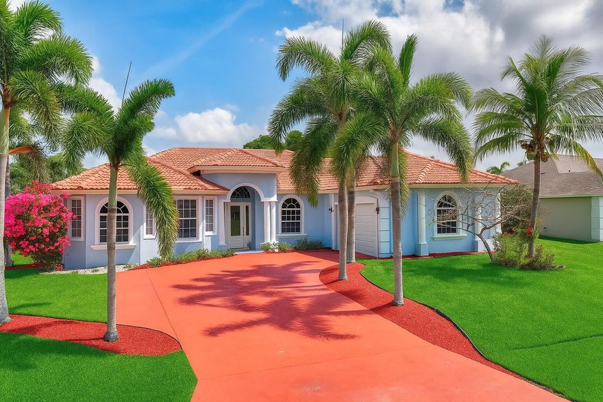 The photos have been virtually staged and enhanced to show the many wonderful options that this home has to offer.  Welcome to this stunning custom-built home perfectly situated on a spacious corner lot, featuring a grand circular driveway with ample parking for multiple vehicles. From the moment you arrive, you'll be captivated by the elegant architectural details and thoughtful design that set this home apart.Step inside to discover gorgeous tile flooring that flows seamlessly throughout, highlighted by custom arched doorways, stately columns, and elegant tray ceilings that add a touch of sophistication to every room. This expansive residence offers 4 bedrooms and 3.5 baths, thoughtfully designed to combine comfort with luxury.