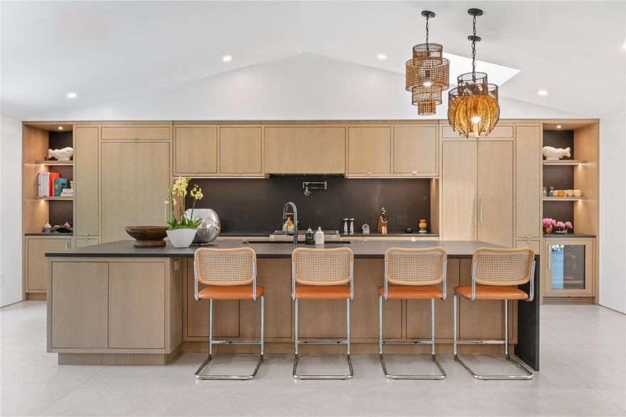 RSVP FOR GATE ACCESS. Custom renovation completed in 2023, this architecturally refined residence features a new roof, plumbing, electrical, windows, and septic system—offering modern infrastructure paired with exceptional design. Privately set on 1.15 acres within one of Boca Raton’s most coveted gated communities, the home showcases elevated craftsmanship, bespoke finishes, and thoughtful detailing throughout.Reimagined with a modern aesthetic, the interiors are distinguished by expansive porcelain tile flooring, custom oak cabinetry, a separate office for those working from home, and a designer chef’s kitchen appointed with premium appliances and tailored millwork—crafted for both everyday living and elevated entertaining. Full-home automation enhances comfort and functionality, while walls of impact glass and fully opening Euro-style sliders flood the home with natural light and create a seamless connection to the outdoors. The living spaces extend to lush, professionally landscaped grounds, where a heated saltwater pool and serene garden views are framed by mature trees, creating a private, estate-like retreat. With generous acreage, curated custom finishes, and a sophisticated design sensibility, this residence presents a rare opportunity to enjoy luxury living in one of Boca Raton’s most prestigious communities.The home is situated one mile from the future Chabad Chai Center of Boca-with anticipated completion in two years.  The property offers a rare balance of accessibility and privacy within the gated enclave of Long Lake Estates.