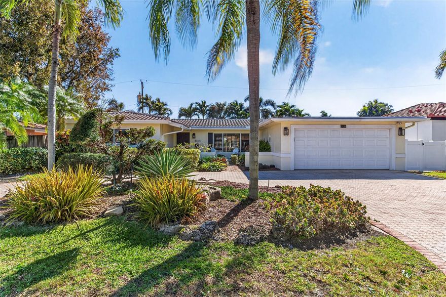 Updated home in the heart of Lighthouse Point offering a bright, open floor plan and exceptional use of space. The white kitchen features quality Alder wood cabinetry, stainless steel appliances, and quartz countertops. Enjoy beautifully landscaped grounds with an inviting outdoor living area perfect for entertaining. Newly installed turf, a baby safety fence, covered living area, and additional outdoor space make this fenced backyard ideal for relaxation and play. Updated bathrooms and freshly painted interiors complete the home. Conveniently located near excellent parks, dining, and shopping, with easy access to beaches and major roadways. Experience the charm and lifestyle of the wonderful waterfront community of Lighthouse Point.