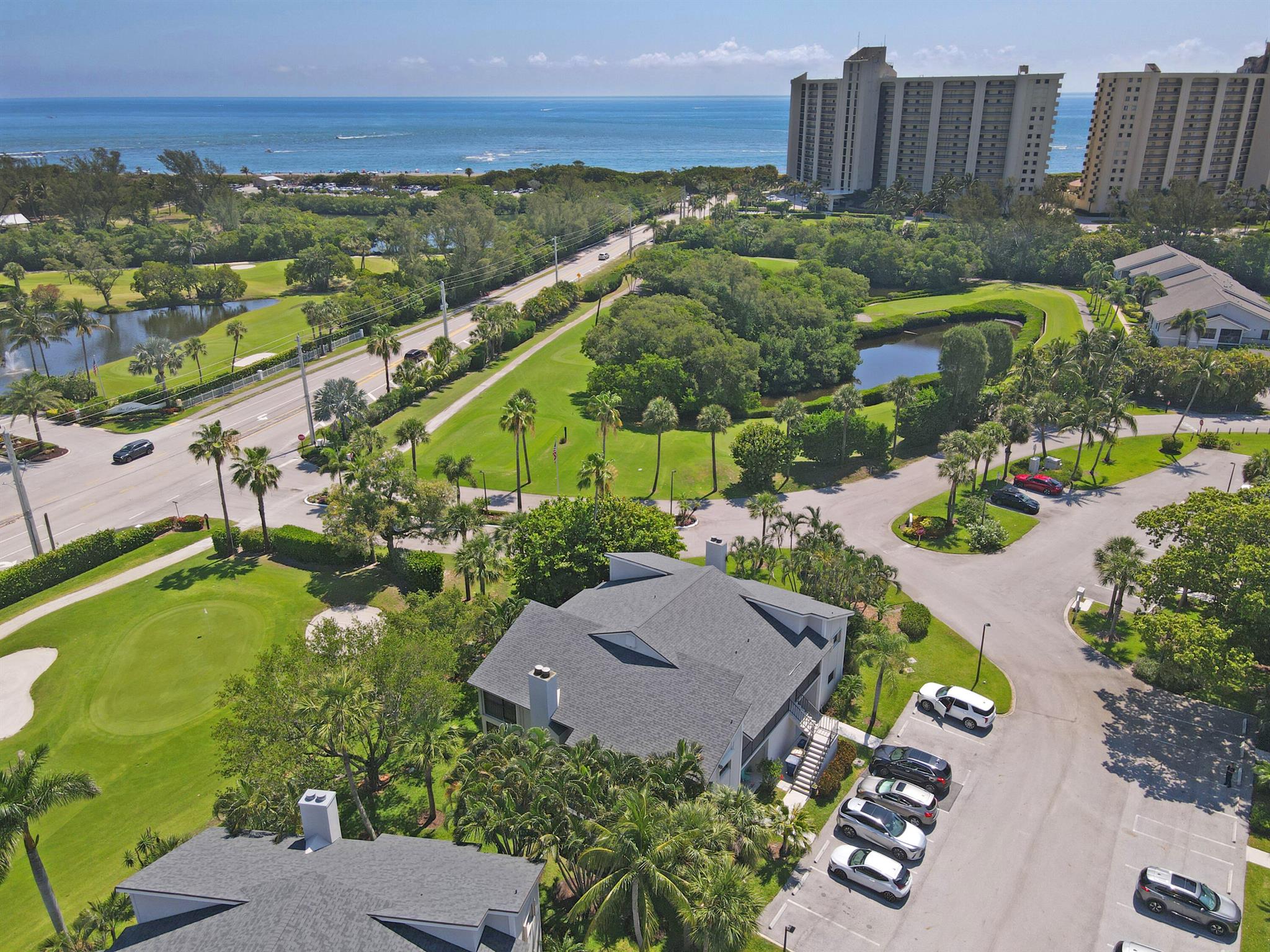 Live the beach life at 102 Clubhouse! This bright and breezy 2nd-floor condo is just a short stroll to the turquoise waters of Jupiter Beach. It's tucked between the ocean, DuBois Park, and Jupiter's beautiful estuary--so you get ocean breezes, golf course views, and gorgeous sunrises right from home. Inside you'll find two spacious bedrooms, two updated bathrooms, a cozy fireplace, and a private balcony off the living room. The unit also features a brand-new roof, a full-size washer and dryer, and a private storage closet for your bikes and beach gear. The community offers two pools, a clubhouse, and no mandatory fees. Walking district to Love Street and restaurants with waterfront views. Many upgrades have been added, including a bonus room and impact doors. This is a must see!!!