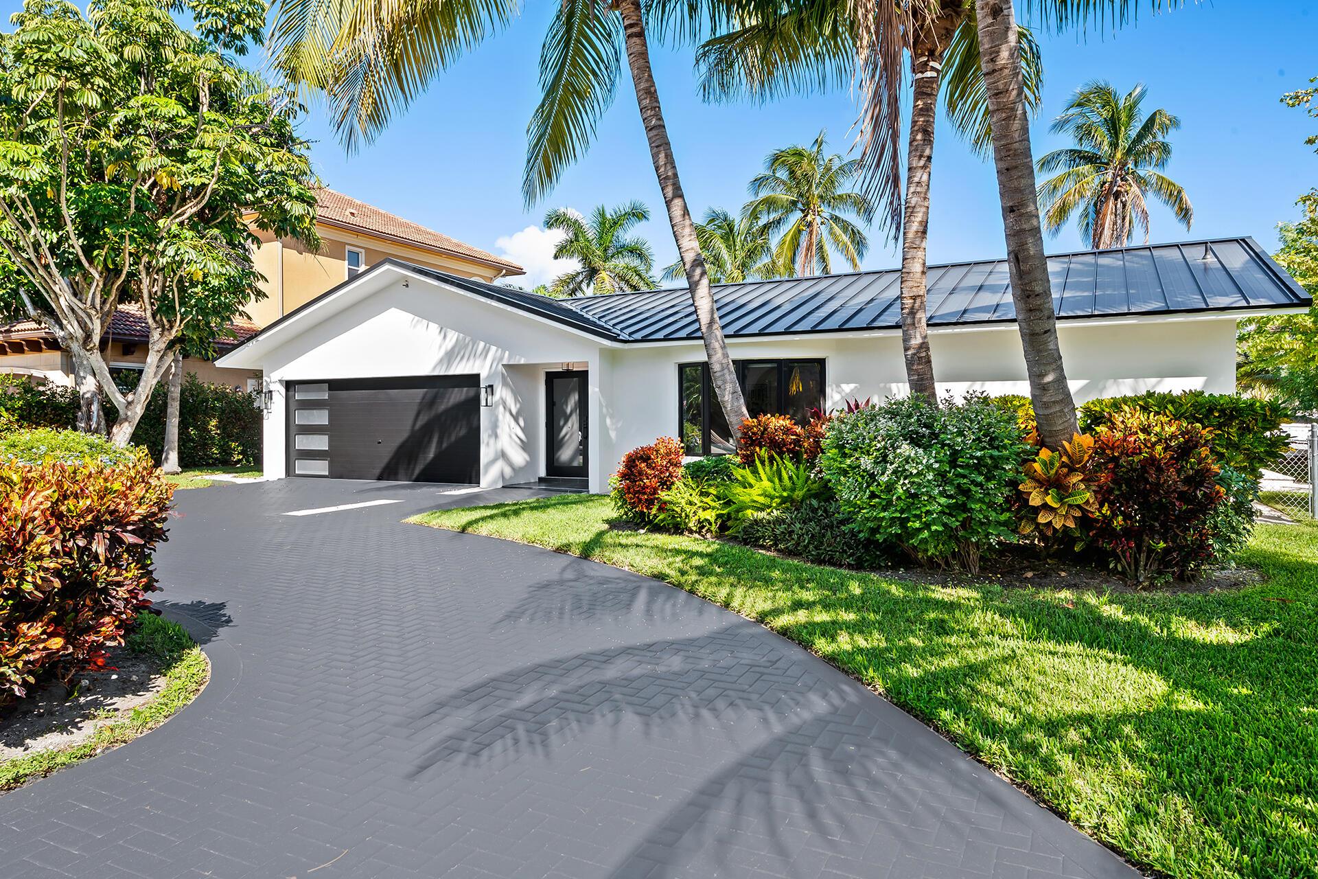 PRICED TO SELL!!!!! Nestled in the charming community of Tropic Isle, Delray Beach. This property offers a perfect blend of modern comfort and coastal elegance. This exquisite property boasts a boaters paradise with 90 feet of water frontage. The home has been tastefully remodeled the with finest of finishings. The outdoor space provides a relaxed yet sophisticated lifestyle.The home's further include a new roof, impact glass, flooring, LED lighting, bathroom and kitchen creating an inviting oasis for both relaxation and entertainment. With its convenient location close to shopping, restaurants and the fantastic downtown Delray. This residence offers the best of coastal living right at their fingertips.