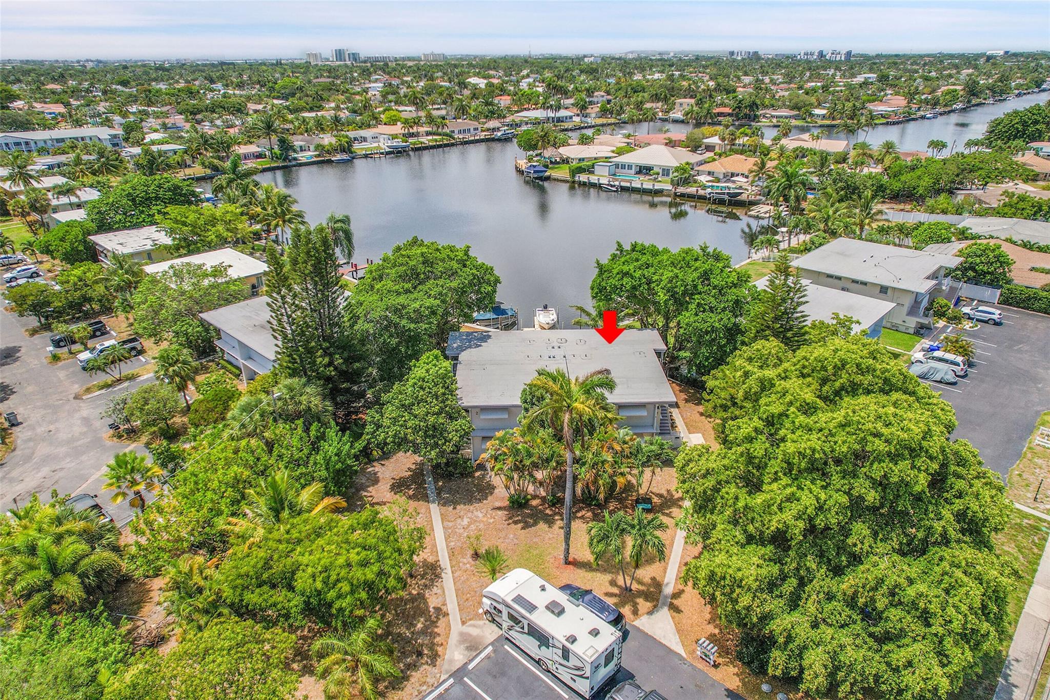 Waterfront first-floor corner unit on Cypress Lake with amazing water views! Includes a free boat slip with ocean access via one fixed bridge. Perfect for boating, kayaking, and watersports. Enjoy a wraparound patio, tile floors, washer/dryer inside unit, storage, shutters, and parking for 2 cars. Unit is being sold fully furnished. Feels like a private home! Small 4-unit co-op in a prime location—just one block to Publix, shopping, and minutes to the beach, Pompano Pier, and dining. All ages welcome, pets allowed, can rent after 2 years. McNab Elementary school district. Full hurricane protection.
