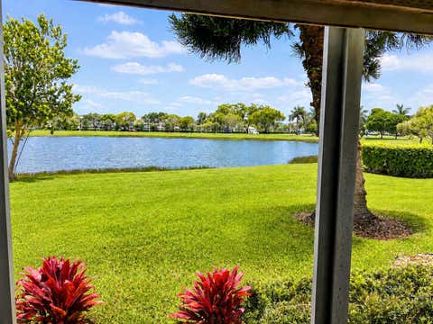2 beds bed, 2 baths bath property at 1015 Ainslie A Drive, Boca Raton, FL 33434