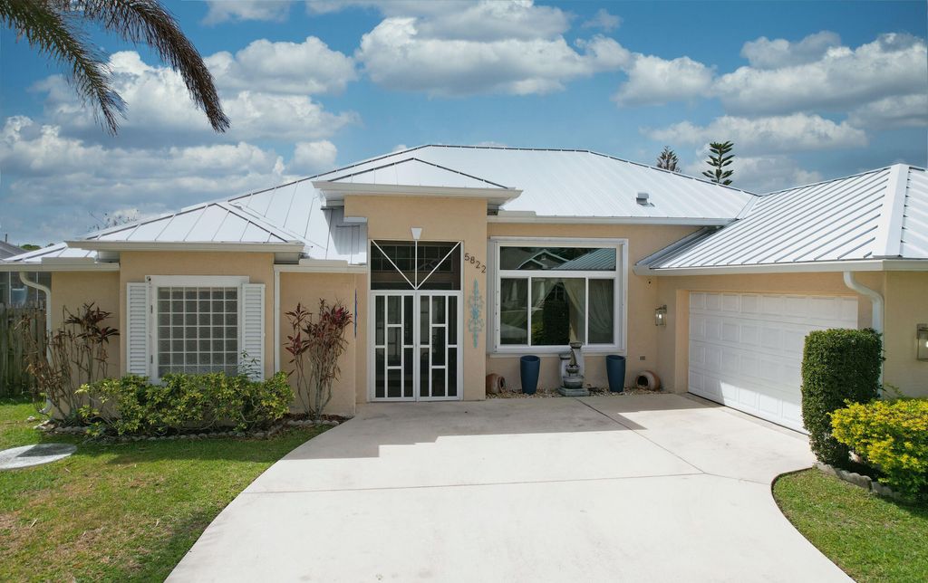 Photo of 5822 NW Bates Avenue, Port Saint Lucie, FL 34986 (MLS # B26011087)