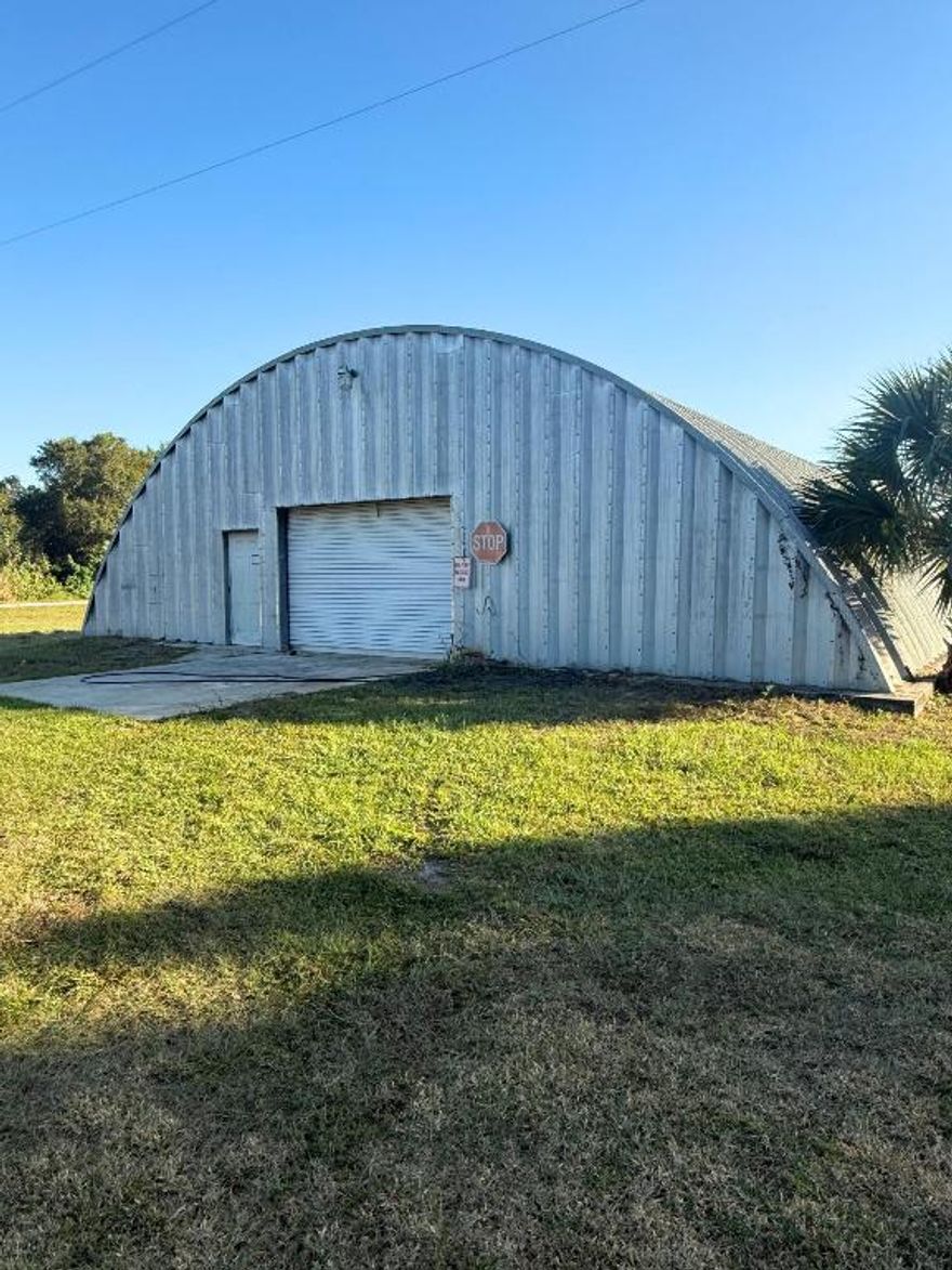 If you need real storage space, here's the move. This 2,550 square foot Quonset-style hangar sits on a private stretch of Ralls Road in Fort Pierce and gives you wide open floor space for vehicles, equipment, or personal storage. Concrete slab. Fully enclosed. Oversized roll-up door. Exactly what you need if you're tired of squeezing things into small units. The hangar has 220V power, water access, and plenty of room to configure your storage however you want. This is strictly for storage use only, no business operations, which keeps the environment quiet and private. Location is clutch. You're right off Selvitz Road with fast access to I-95, the Turnpike, and all major corridors through St. Lucie County.