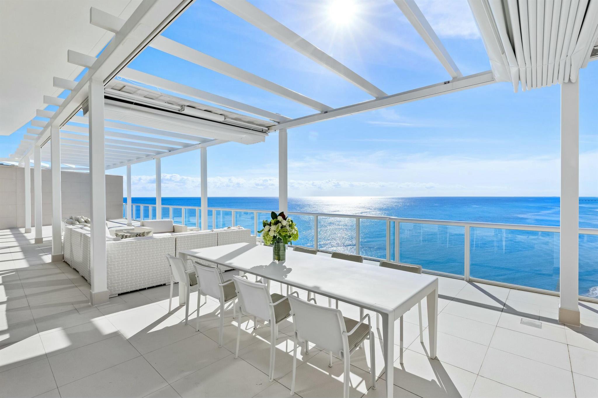 The Sky Penthouse at One Thousand Ocean in Boca Raton is a rare and exceptional residence, blending architectural grandeur with unparalleled luxury. Conceived by Garcia Stromberg Architecture, masterfully executed by Cudmore Builders, and elegantly curated by Shuster Design Studio, this breathtaking penthouse spans 9,303 total square feet, with 6,037 square feet under air. Offering the most extraordinary panoramic views in Boca Raton, the Sky Penthouse boasts unobstructed vistas of the Atlantic Ocean to the east and the Intracoastal Waterway to the west, framing the landscape with breathtaking natural beauty.