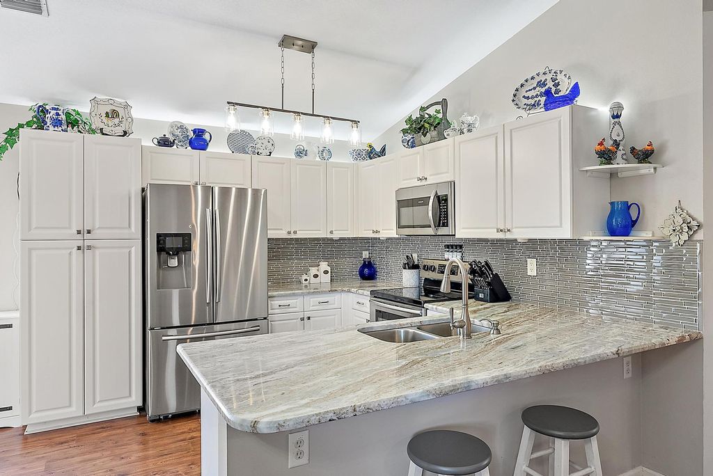 Photo of 2740 SW Versailles Terrace, Stuart, FL 34997 (MLS # R11109988)