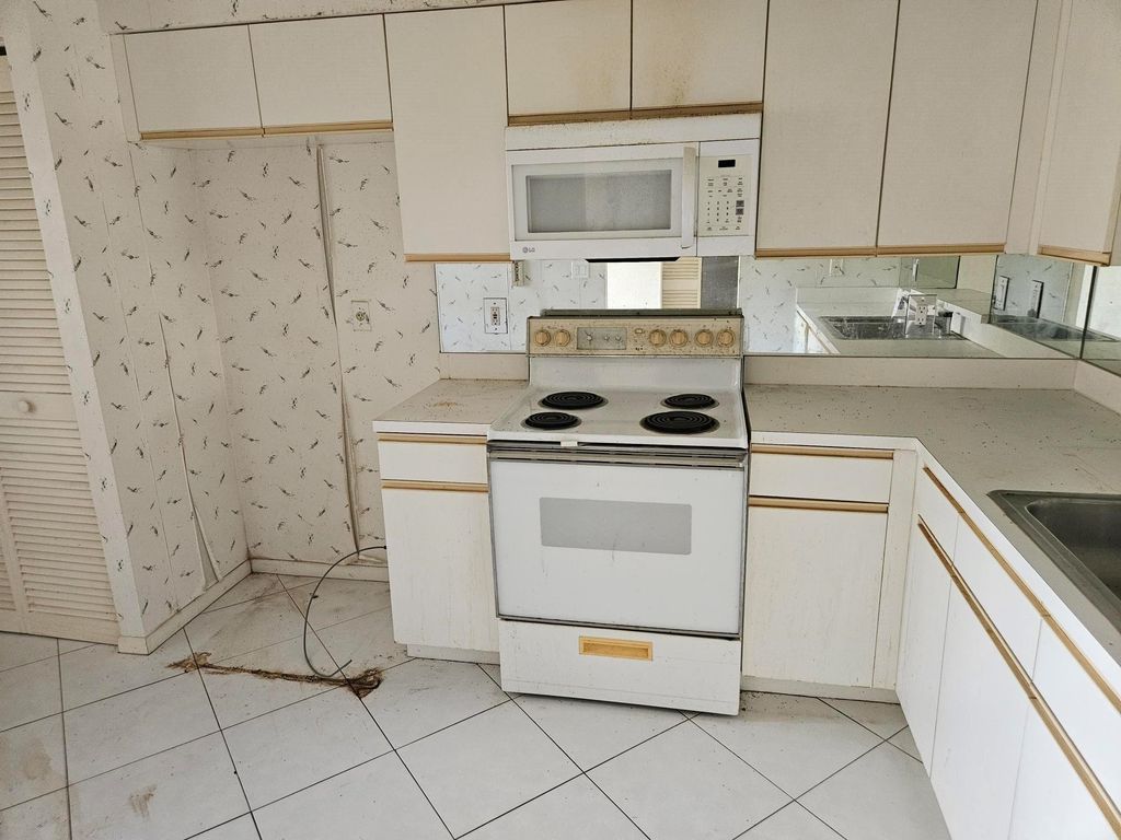 Photo of 6065 Pointe Regal Circle #105, Delray Beach, FL 33484 (MLS # F10556437)