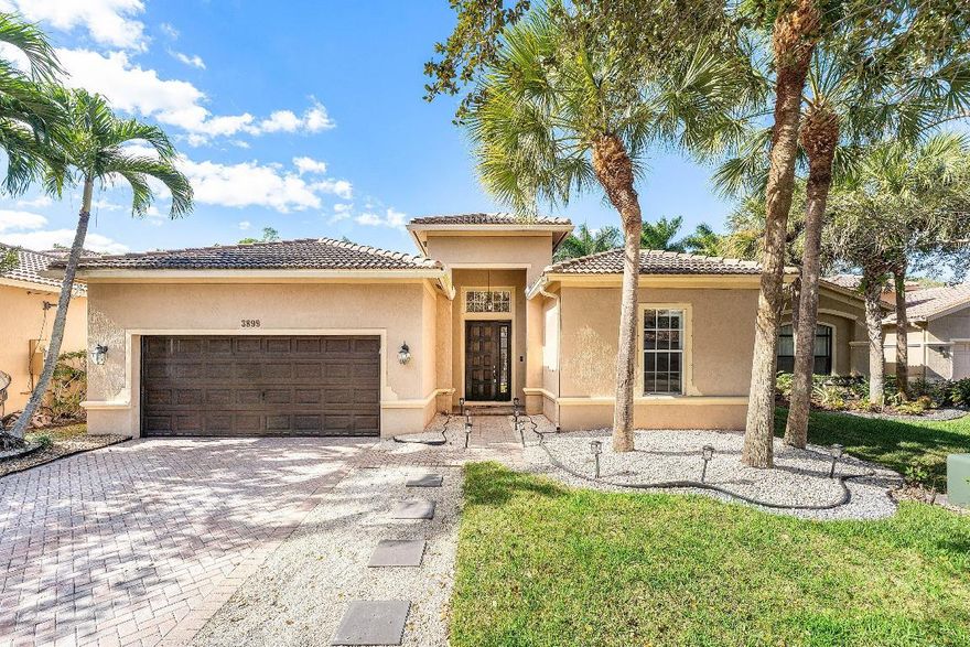 In the latest episode of your suburban dream home we bring you this immaculately maintained home on a private cul-de-sac in the sought after guard-gated Isles at Weston. Bright open layout with modern tile floors, renovated kitchen with wood cabinets, granite counters, stainless appliances, and a custom bar with wine fridge. Spacious primary suite with a luxurious bath. Enjoy a screened patio and private backyard with no rear neighbors. Park your car in your spacious garage and driveway on this epi tree lined street! This community offers resort-style amenities and is close to top-rated schools, parks, dining, and i75, Sawgrass and 595 for easy commuting.