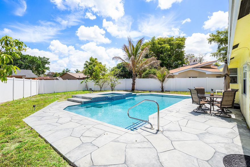 "Great Opportunity" to own a cul-de-sac corner lot in sought-after La Mancha, this private CBS pool home offers a circular driveway and expansive fenced backyard with 6' white vinyl fencing. Recent upgrades include washer & dryer 2025, hot water heater & pool pump 2025, A/C 2023, and electrical panel updated to code 2021. The 2022 remodeled kitchen & baths feature updated S/S appliances, complemented by a resurfaced pool & patio. Enjoy a resort-style setting with an inground game pool, child safety fence, and raised spa w/waterfalls. Interior highlights include vaulted ceilings, tile flooring throughout, cedar plank accent wall, and French doors w/built-in shades. Additional features include hurricane protection, pull-down attic w/partial decking, and sprinkler system on a separate well. Vacant and quick closing available.... Call today before it's gone, this truly will not last!