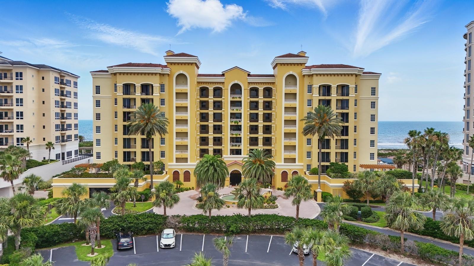 Direct Oceanfront Luxury Condo in Hammock Dunes - Built by WCI Welcome to oceanfront elegance in the exclusive, gated community of Hammock Dunes. This beautifully updated condo in the Savona building offers a luxurious coastal lifestyle with breathtaking ocean views from every primary room. Just a short stroll to the beach, golf course, and the Hammock Dunes Clubhouse, this home provides the perfect balance of serenity and convenience. Designed with an open-concept floor plan, the residence features a spacious oceanfront balcony ideal for dining al fresco while enjoying the soothing sound of waves. The gourmet kitchen has been recently updated with KitchenAid appliances, striking leather-finish granite countertops, and stylish finishes throughout.