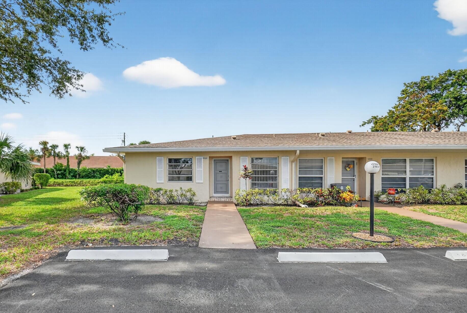 Here's the perfect opportunity to own a charming and well-maintained 2-bedroom, 2-bathroom home nestled on a premium corner lot with tranquil water views in this highly sought-after 55+ gated community of Boca Lakes. Boasting 1,332 sq ft of bright and inviting living space, this home offers a thoughtfully designed layout perfect for both relaxing and entertaining. The spacious eat-in kitchen features ample cabinetry and counter space, along with all major appliances including a refrigerator, stove, dishwasher, and microwave. An in-unit washer and dryer add to the convenience. This home offers two generously sized bedrooms, each with its own private ensuite bathroom, ensuring maximum comfort and privacy. The primary suite includes both a walk-in closet and an additional closet for extra