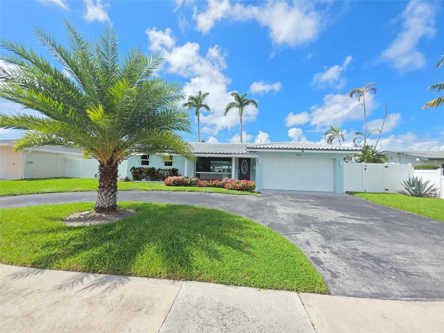 Great neighborhood, NO HOA.  Beautiful peaceful backyard with nice shade tree.  Freeform pool.  20 lb boat lift.  Open floor plan with split bedrooms.  Nice curb appeal.  New roof going on.  New impact windows.  Large circular drive.  Large 2 car garage.  Back room with expansive view of water and backyard.  Room to put an office and pool table,  etc.  Great place to call home!