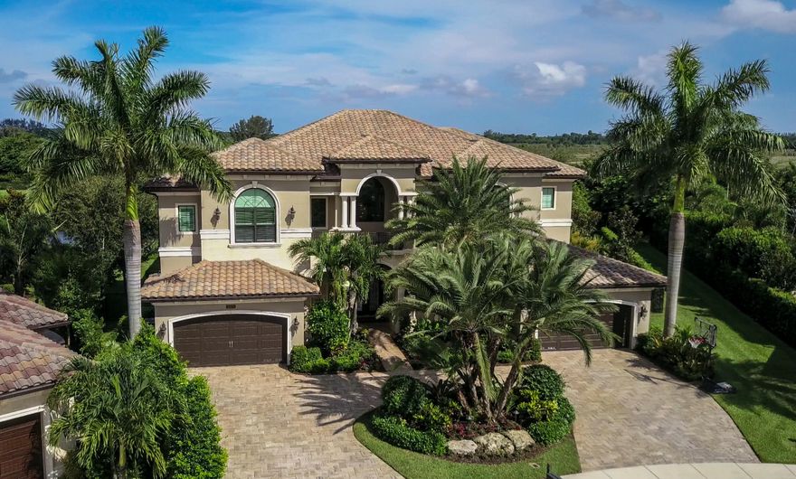 MAGNIFICENT LAKE VIEW CONTEMPORARY CUSTOM  ESTATE HOME SITUATED ALMOST 1/2 ACRE. PROFESSIONALLY DESIGNED UPGRADED MODEL IMAGINABLE!OVER $600,000 IN BUILDER AND AFTER MARKET UPGRADES. THIS RESIDENCE OF 6 BEDROOMS 6.2 BATHS PLUS 4 CAR GARAGE OFFERS'S PLENTY OF SPACE FOR ENTERTAINING IN LUXURY. MAIN LIVING AREAS HAVE CREMA MARFIL FLOORS. A FORMAL DINING ROOM,GAME ROOM, FULL BAR,SMART HOME TOTAL HOME AUTOMATION,  CUSTOM FIREPLACE, MEDIA ROOM ,WINE ROOM,ELEVATOR,MUD ROOM ,LAUNDRY ROOMS ON 2 LEVELS. THE SECOND FLOOR BOASTS WOOD FLOORS WITH 4 EN SUITE BEDROOMS AND PLAYROOM . MASTER SUITE INCLUDES A LAVISH BATH,HIS AN HER CUSTOM CLOSETS, SCREENED BALCONY FOR RELAXING. THE HIGHLIGHT IS THE  RESORT STYLE BACKYARD, CUSTOM SUMMER KITCHEN AN HEATED SALT WATER POOL.