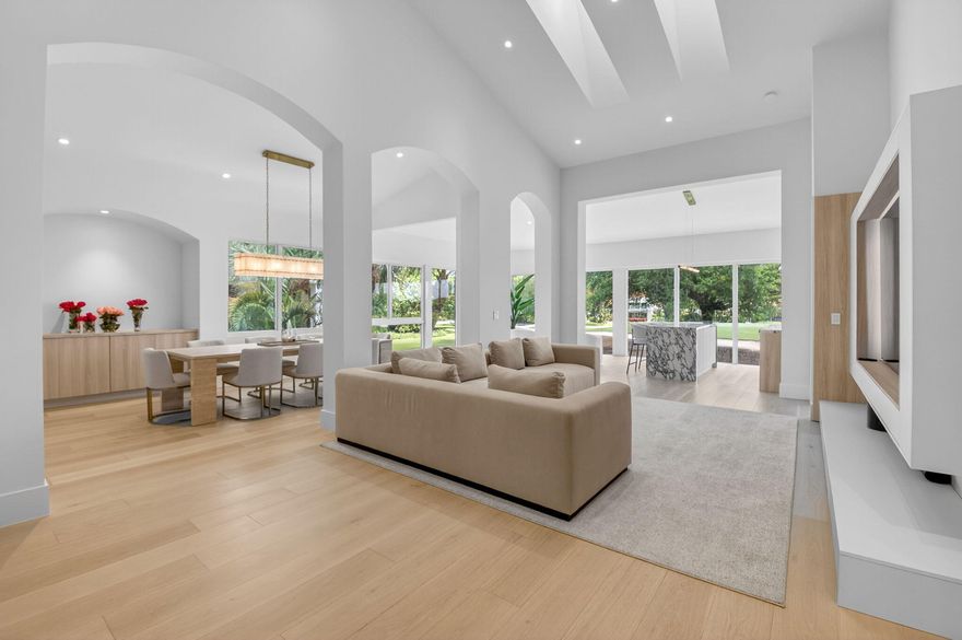 Welcome to this spectacular, fully renovated penthouse offering 3 bedrooms, 3.5 bathrooms, and 2,950 square feet of thoughtfully redesigned living space. This residence features a private elevator and stunning panoramic golf course views. Completed in 2025-2026, the home showcases high-end modern finishes, volume ceilings, and an open floor plan ideal for both everyday living and entertaining. Expansive wraparound impact windows flood the home with natural light while showcasing beautiful, unobstructed views of the golf course. The designer kitchen features a large island and quartz countertop, sleek custom cabinetry, premium appliances, and a seamless flow into the living and dining area. Enjoy your favorite drink at the beautiful custom bar with a waterfall countertop and seating,  creating the perfect space to entertain. The split-bedroom floor plan provides ultimate privacy, with each bedroom offering its own en-suite bath. A fourth room features a unique hidden door, making it ideal for a home office, media room, or playroom. This home is one of a kind! Come experience a sophisticated yet comfortable lifestyle at Broken Sound, one of Boca Raton's most sought-after country clubs.