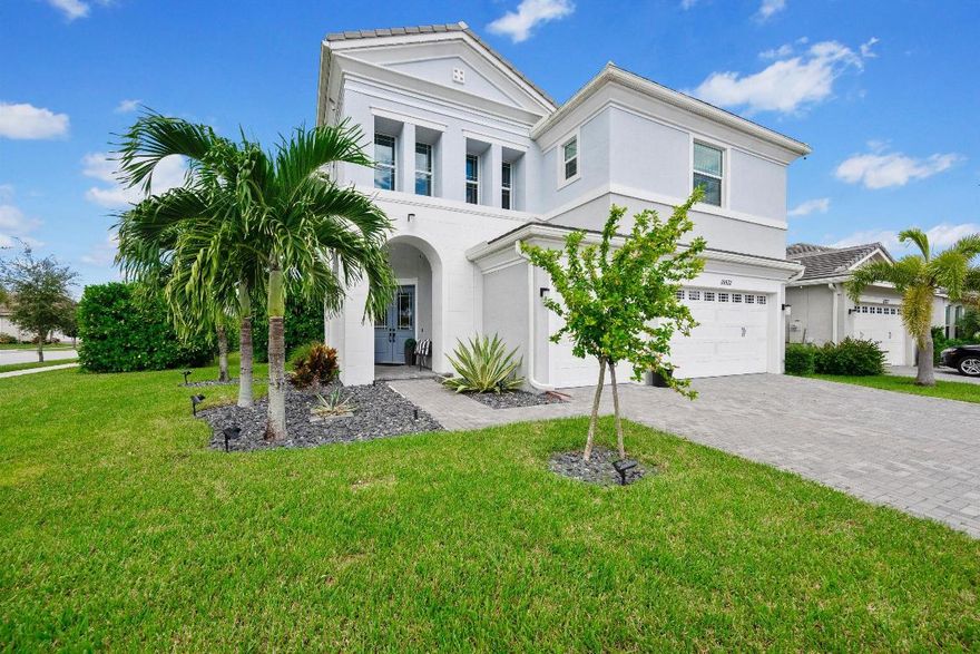 This stunning Laurel Grand model delivers modern design and effortless living in one of Westlake's most desirable neighborhoods. A dramatic double-door entry opens to soaring ceilings, a sleek open layout, and wood-look tile throughout the main living areas. The chef's kitchen takes center stage with an oversized island, granite countertops, full-height stacked cabinetry with glass-front uppers, stainless steel appliances, gas cooktop, wall oven, farmhouse sink, and statement pendant lighting - perfect for both everyday living and entertaining.
The great room and dining area flow seamlessly to wide sliding glass doors leading to a gorgeous extented screened-in patio, ideal for indoor-outdoor living. Upstairs, a spacious loft offers a flexible entertainment retreat for movie nights, game days, orsecondary living space. The primary suite is a true escape, featuring a custom accent wall, tray ceiling, and a spa-style bath with dual vanities and a frameless glass shower.

Additional features include a flex room for office or play, a designer laundry room with cabinetry and sink, and a three-car garage with upgraded storage. The fenced backyard offers privacy, green space, and room for a future pool. Located in The Groves of Westlake, residents enjoy access to Adventure Park with a lagoon-style pool, water slide, splash pad, sports courts, playground, dog park, and more.