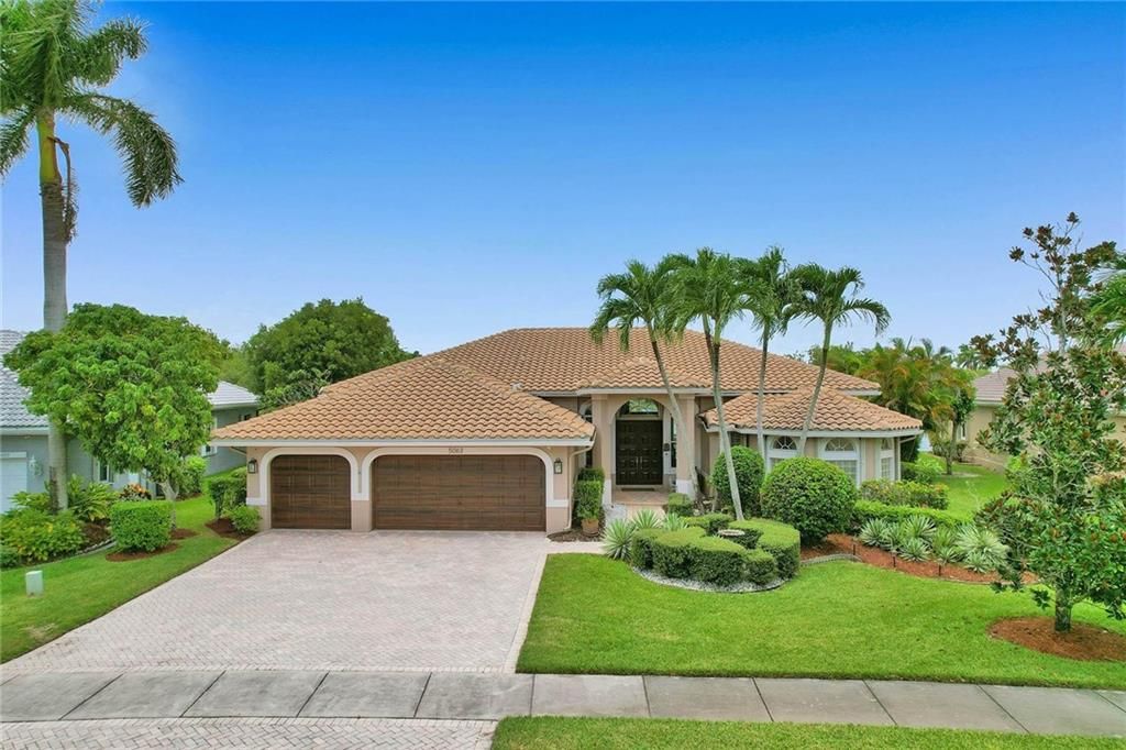 Photo of 5063 Kensington Cir, Coral Springs, FL 33076 (MLS # F10297474)