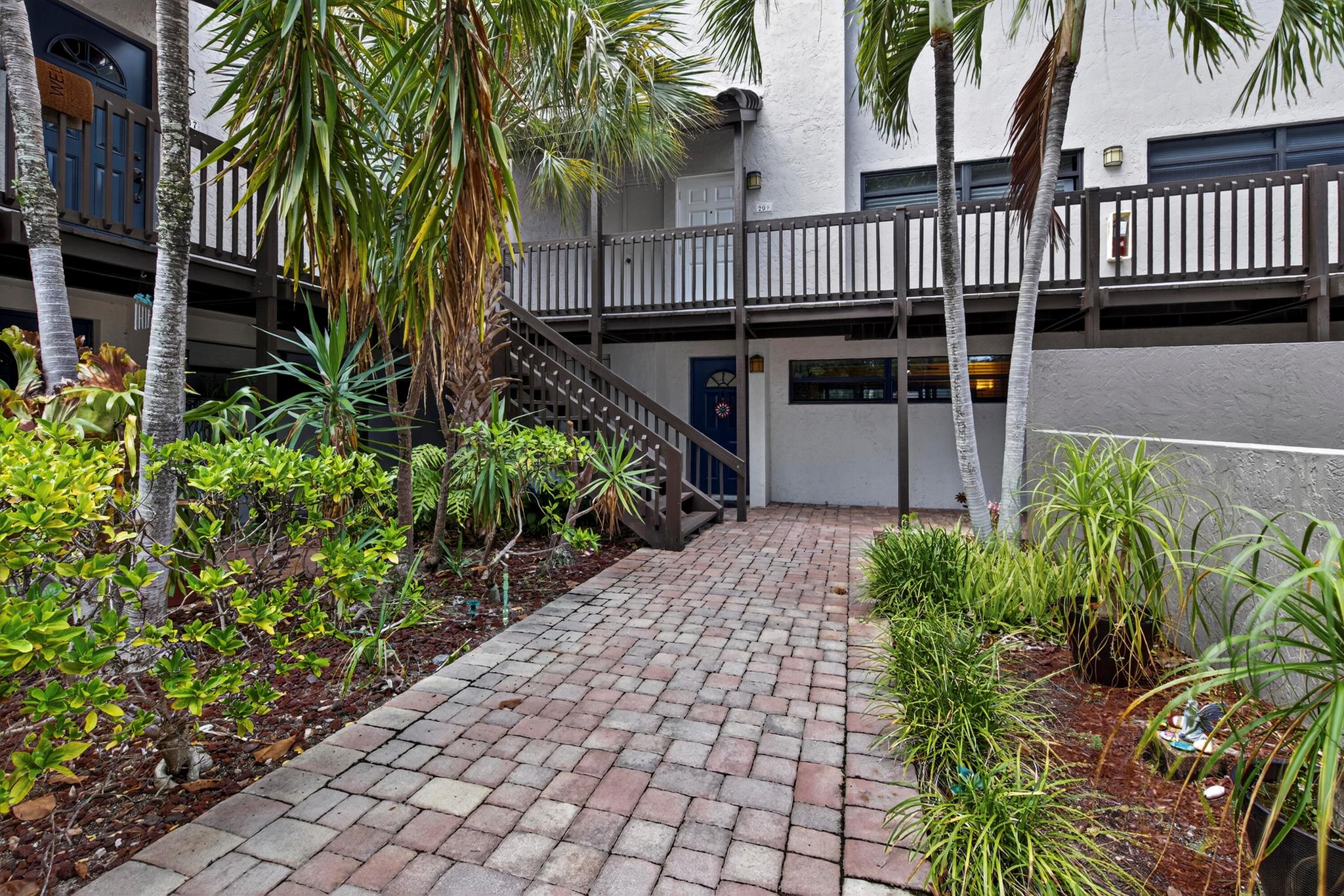 EAST BOCA!!! Spacious 2 bedroom 2 bath condo with 1,286 sq ft of living area. Large rooms with an abundance of natural light. Hurricane Impact windows, new roof, updated kitchen and baths, brand new hot water heater, porcelain tile flooring throughout, and a beautiful screened patio offering a serene view of the lush greenery and elegant banyan trees. Close to pool. This is an all age community and your beloved pets are allowed (2 under 25 lbs). The building has passed the 30 year structural integrity inspection. No lease for the first 2 years. Plenty of guest parking, community pool, BBQ area, pickleball/tennis court, and clubhouse. Minutes from the beautiful beaches, Mizner Park & the trendy Atlantic Ave.